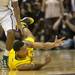 Michigan sophomore Trey Burke shovels the ball to a teammate from the floor during the first half at Breslin Center in East Lansing on Tuesday, Feb. 12. Melanie Maxwell I AnnArbor.com